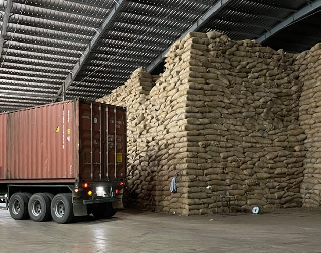 truck in warehouse full of packaged nuts for distribution